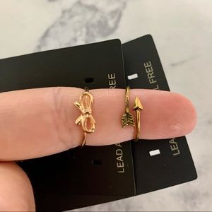 2 Brandy Melville rings - gold bow; gold arrow